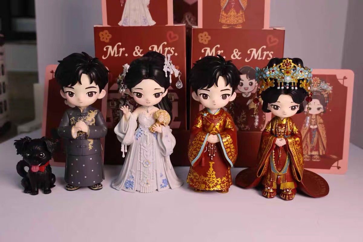 Traditional wedding figures with detailed garments