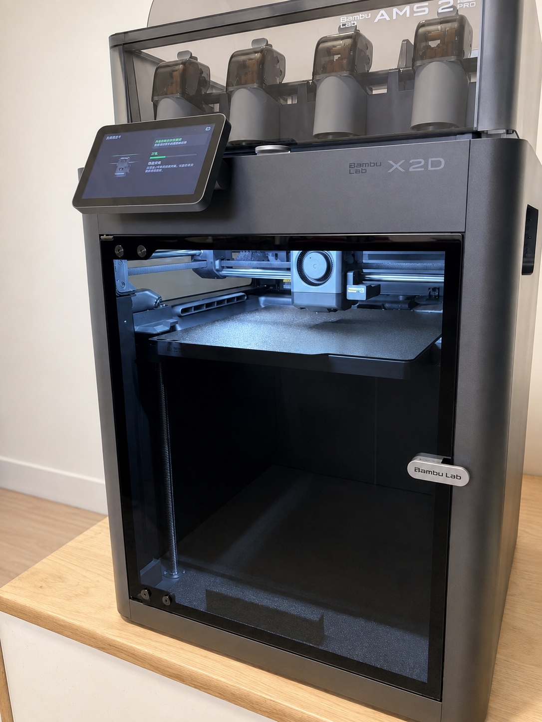 AI-retouched photograph of our Bambu Lab X2D printer, showing its front enclosure and empty build plate.